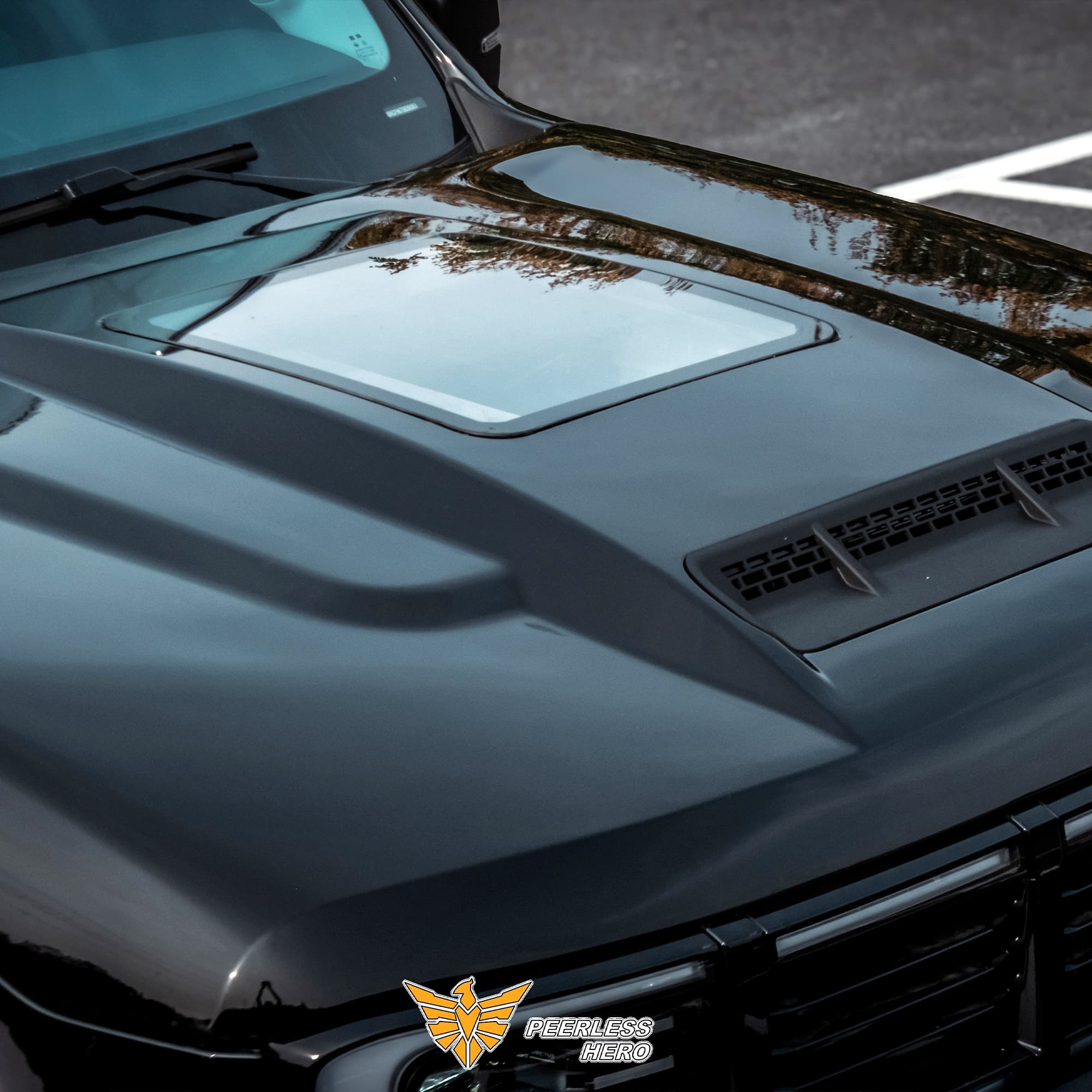 Modified hood with raised forms and vent detail