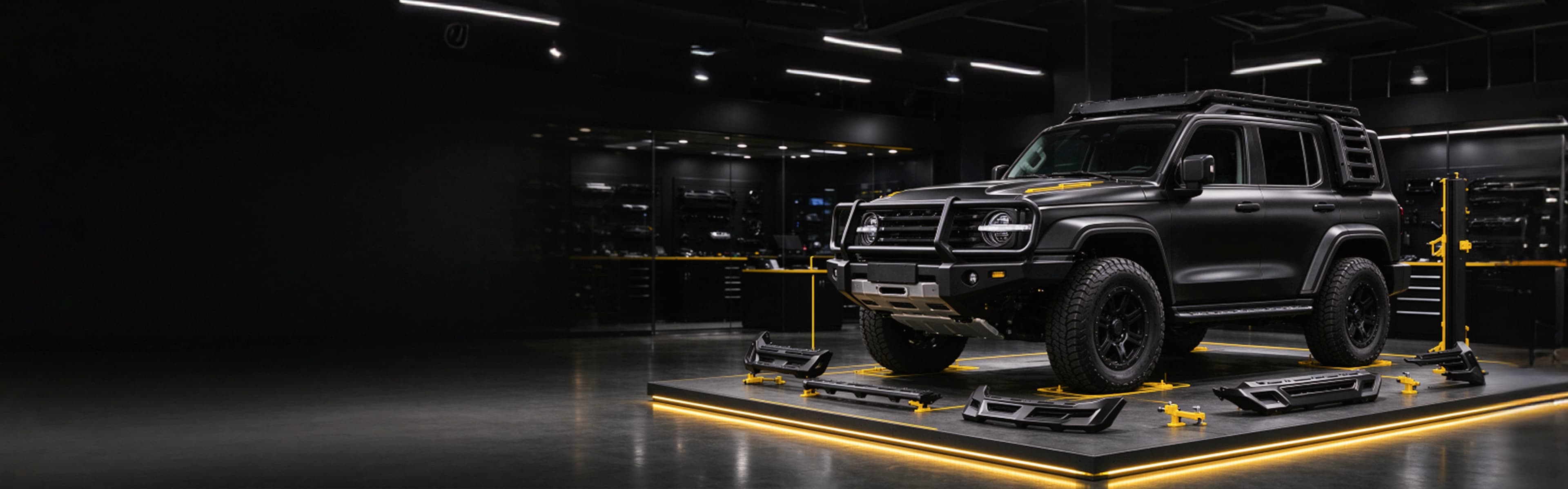 Black off-road SUV with a roof rack and front guard on a display platform surrounded by accessory parts