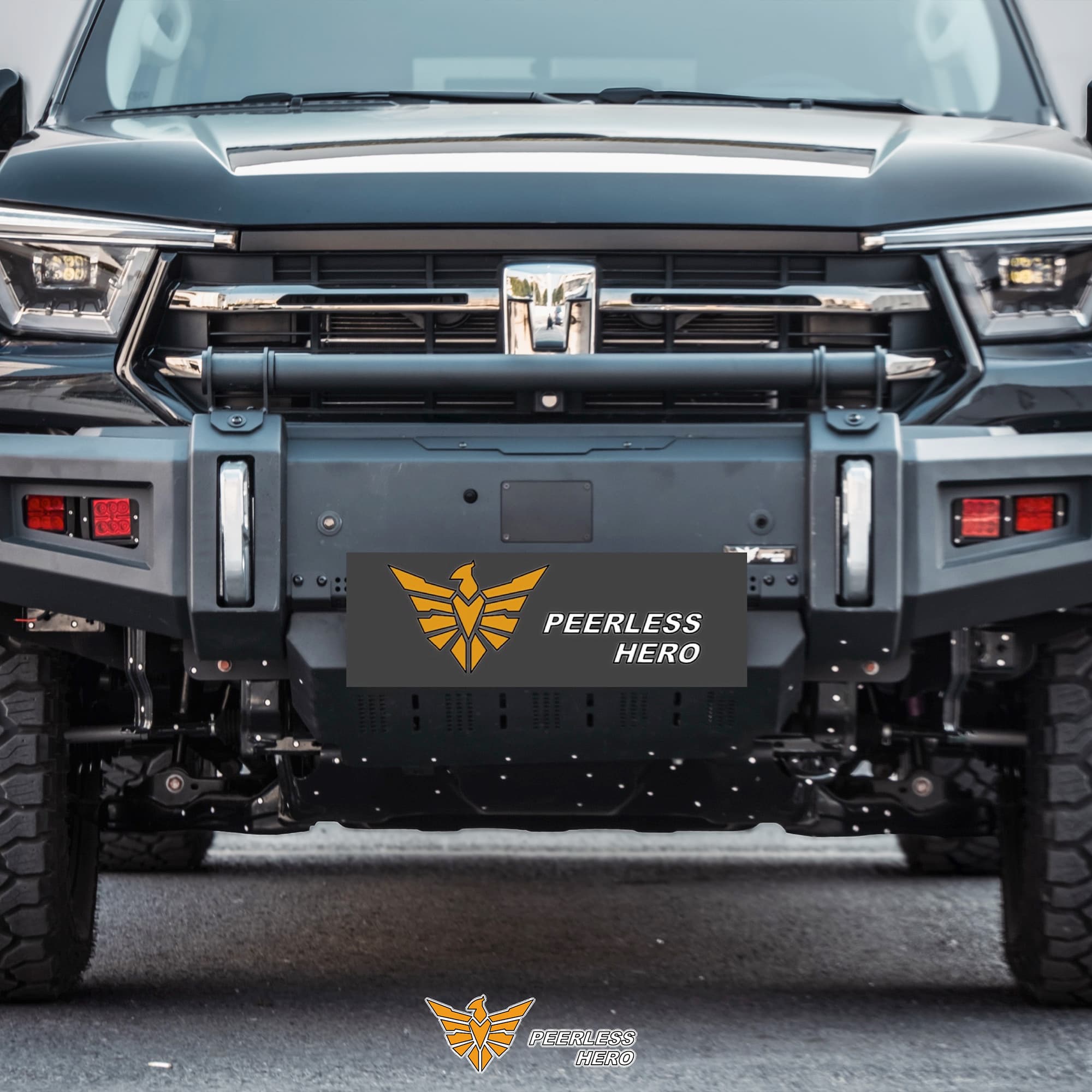 Front competition bumper installed on a Tank vehicle with a Peerless Hero name plate and a lower plate