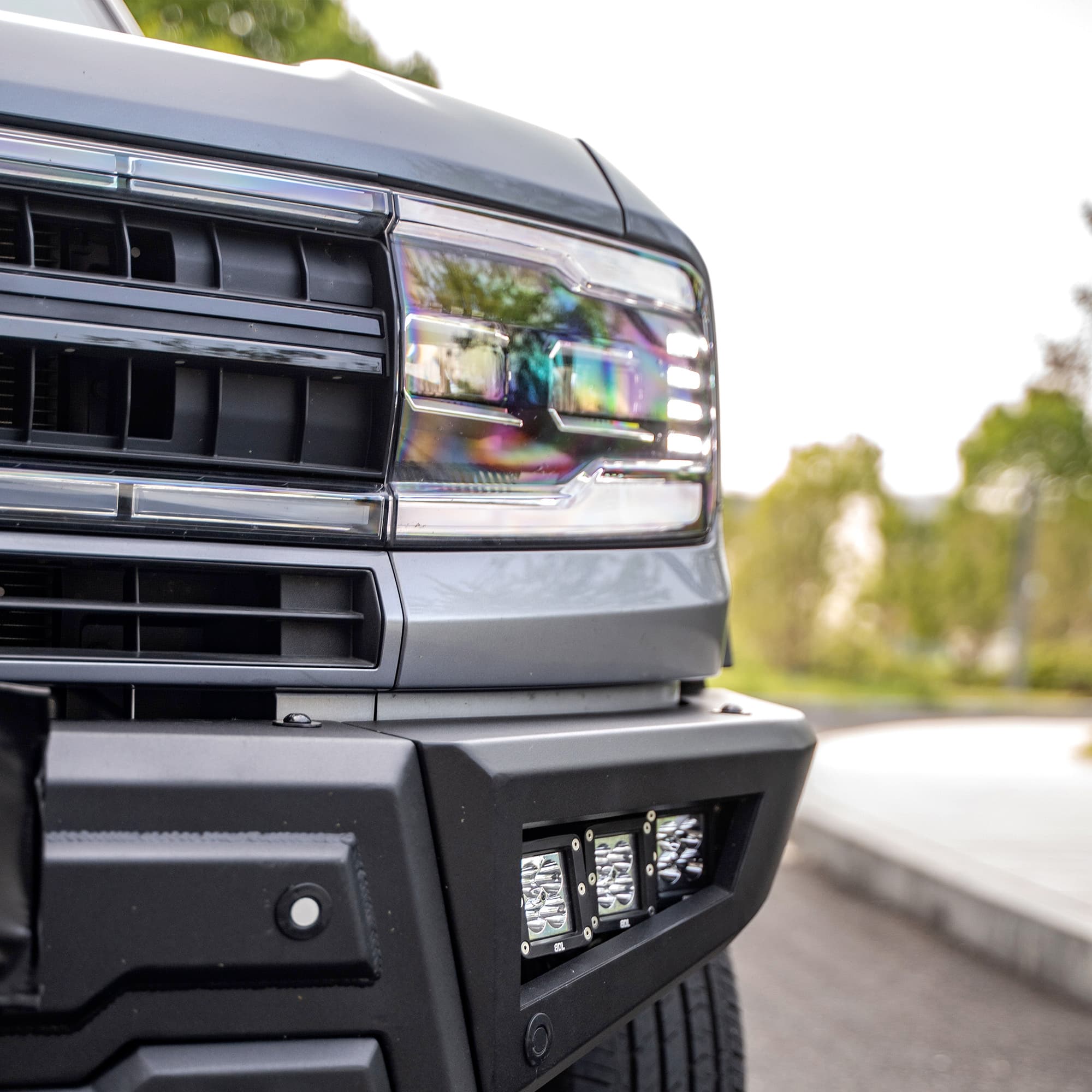 Close view of a front competition bumper with recessed lights installed on a Fangchengbao vehicle
